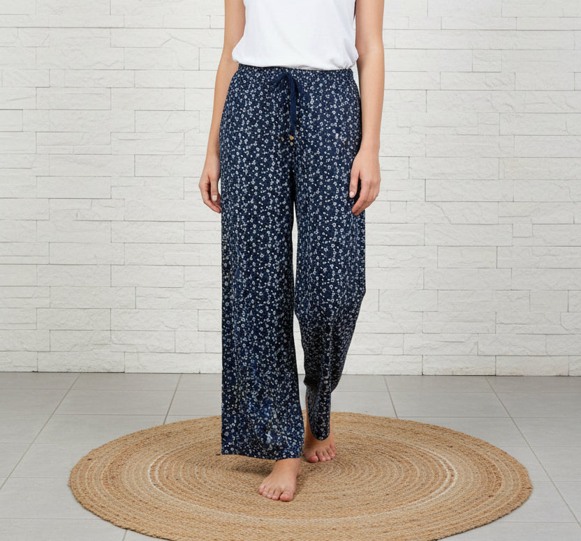 Pantaloni neri a fiorellini bianchi con vita elasticizzata taglia unica 44/54