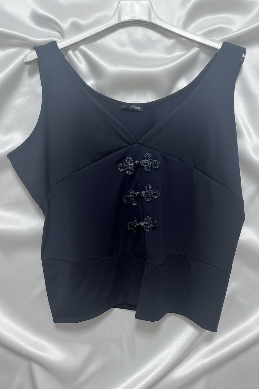 Top senza maniche nero con chiusure a nodo decorative e scollo a V