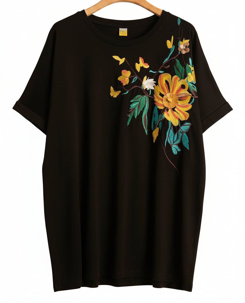 T-shirt oversize nera con ricamo floreale giallo