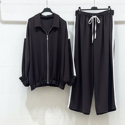 Completo due pezzi marrone scuro con banda bianca - giacca zip e pantalone wide leg