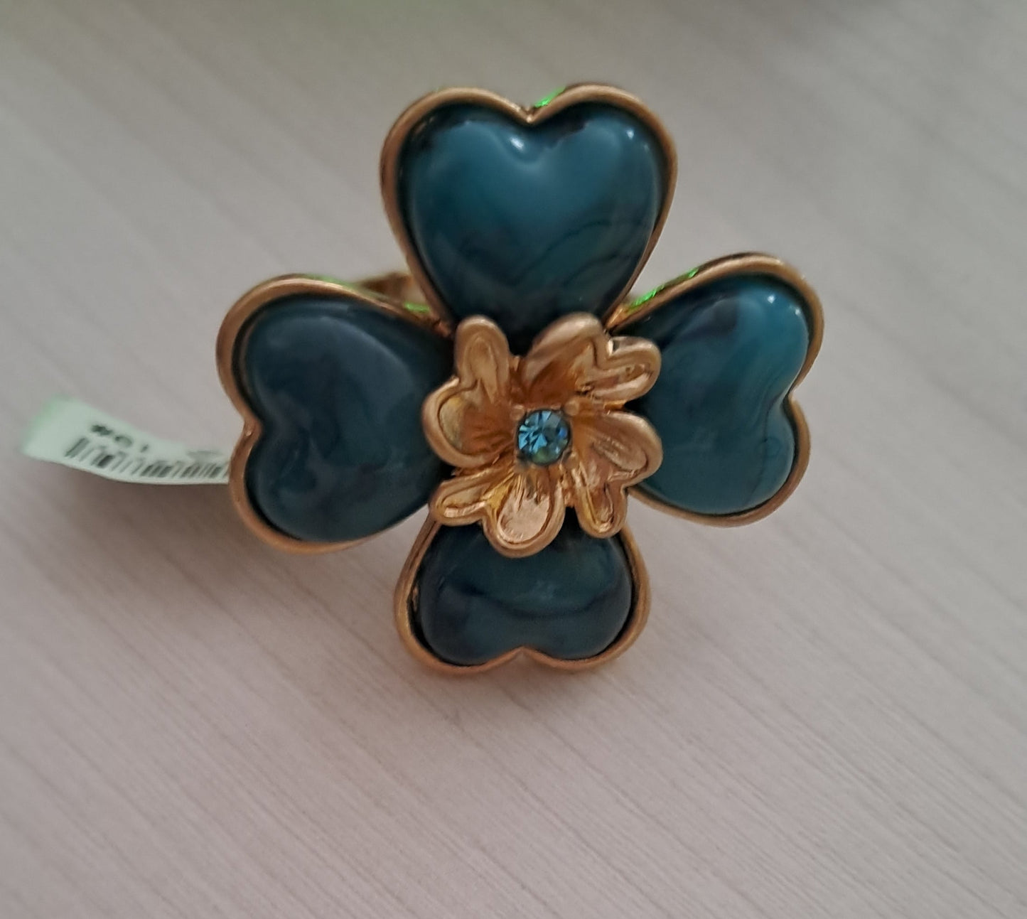 Anello con elastico adattabile quadrifoglio smeraldo e fiore dorato