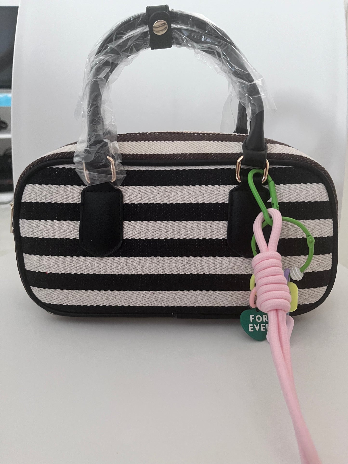 Mini bowling bag a righe con charm