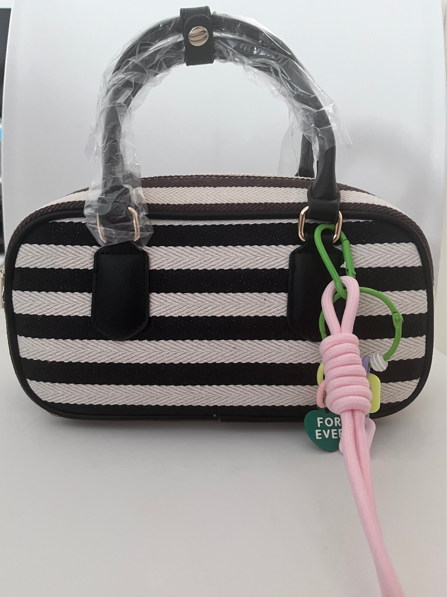 Mini bowling bag a righe con charm