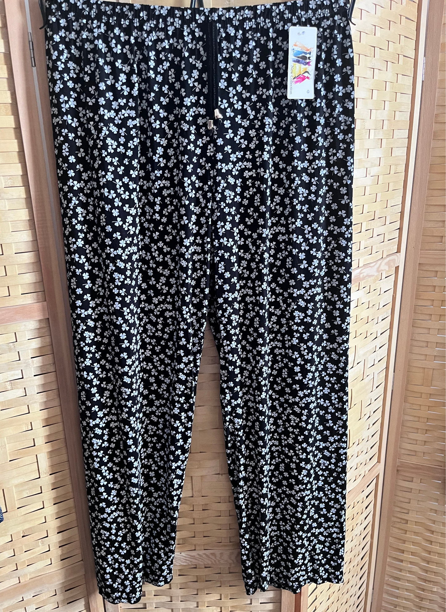 Pantaloni neri a fiorellini bianchi con vita elasticizzata taglia unica 42/50