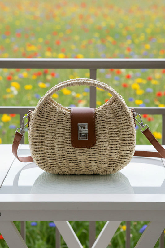 Borsa a mezzaluna in rafia avorio - dettaglio chiusura in cuoio cognac