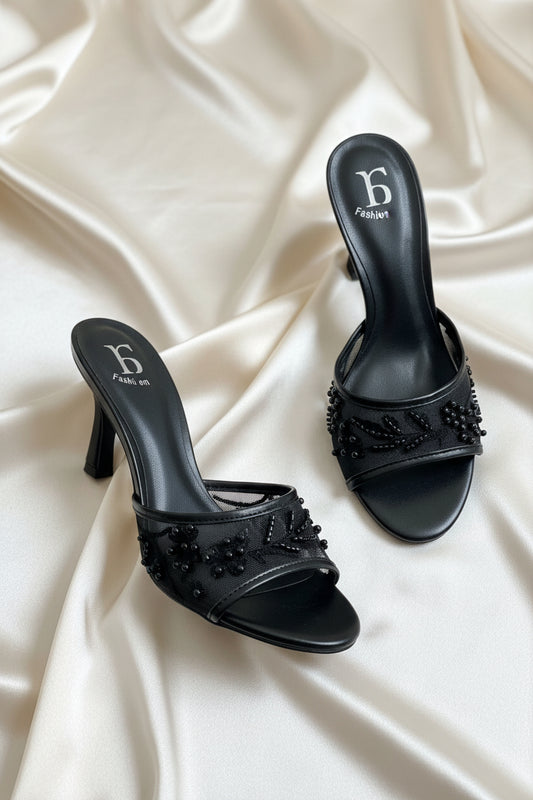 Mules nere con ricami floreali a rilievo