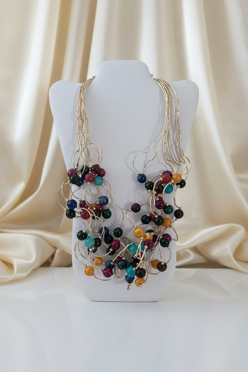 Collana multifilo dorata con perle colorate