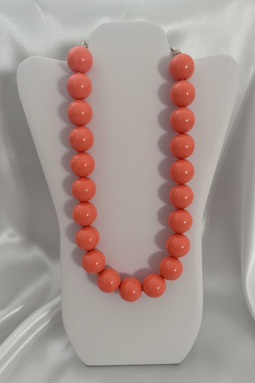 Collana a grandi sfere lucide color corallo