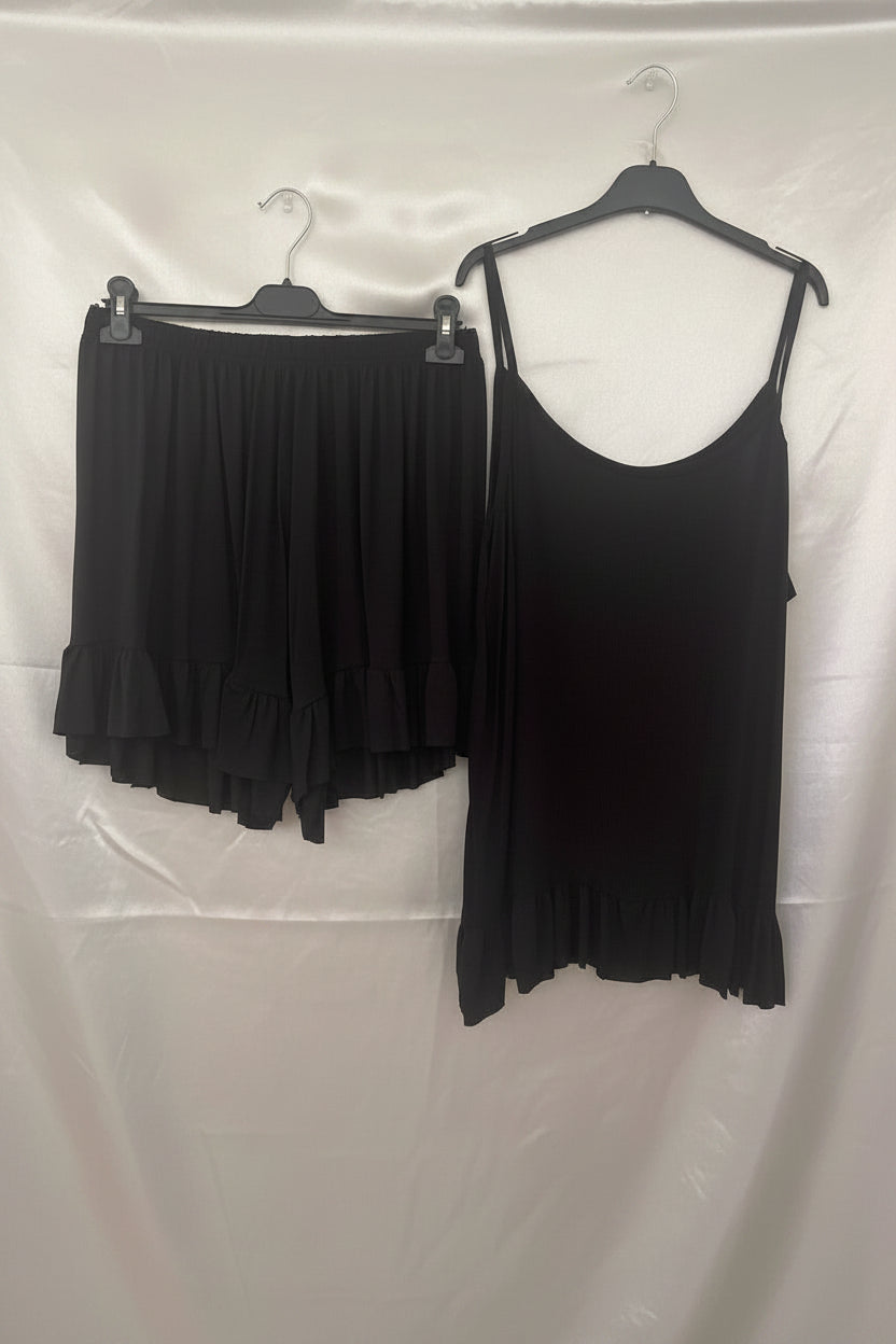Coordinato nero top con bretelle e shorts con volant