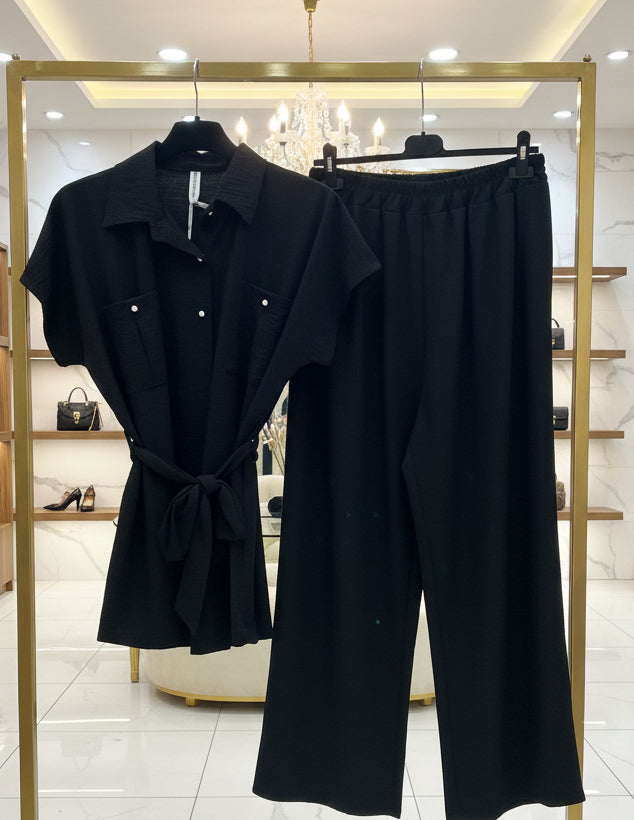 Completo due pezzi nero: camicia con nodo e pantaloni a gamba larga