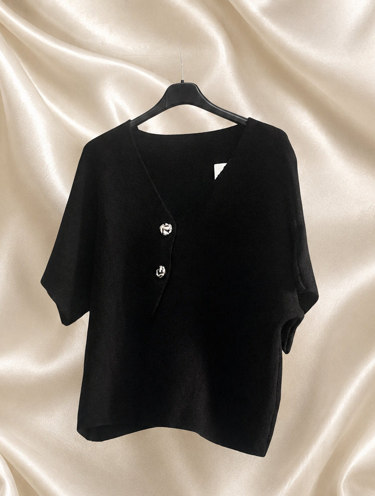 Cardigan corto nero con bottoni decorativi