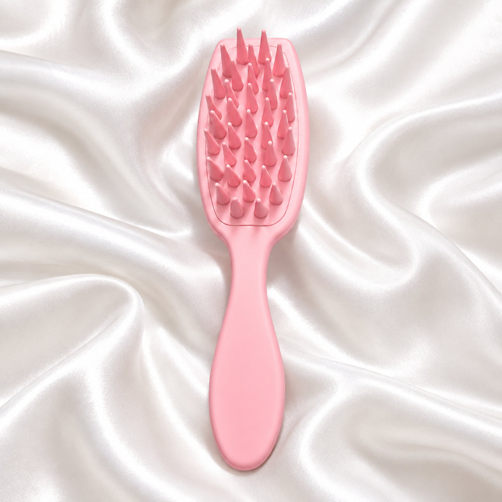 Spazzola massaggiante per capelli rosa